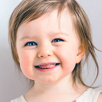 Happy smiling funny toddler at a Preschool & Daycare Serving Conway & Myrtle Beach, SC