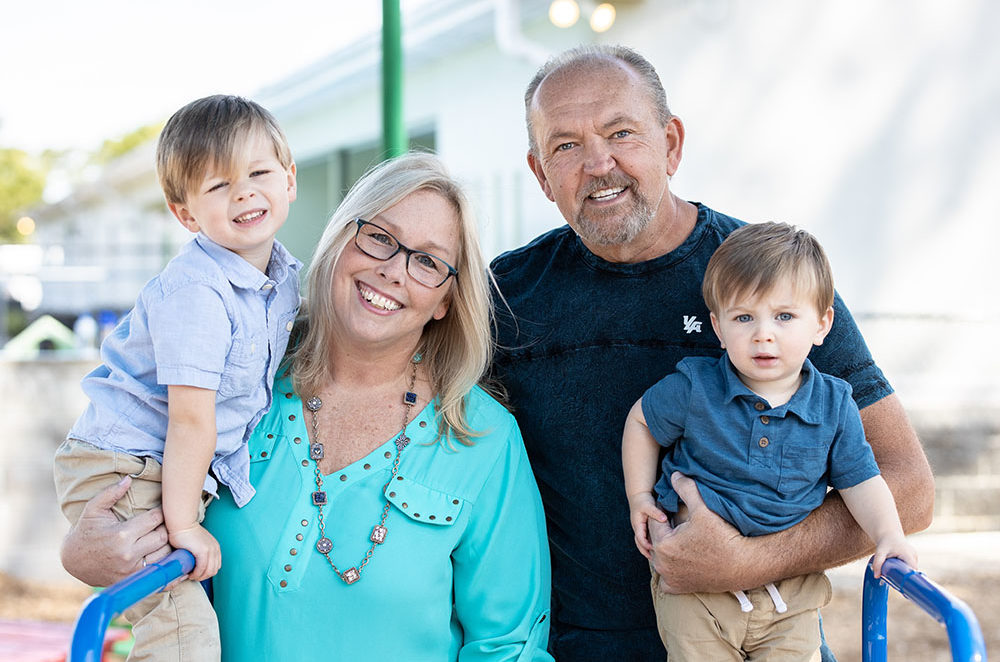 happy family smiling at a Preschool & Daycare Serving Conway & Myrtle Beach, SC