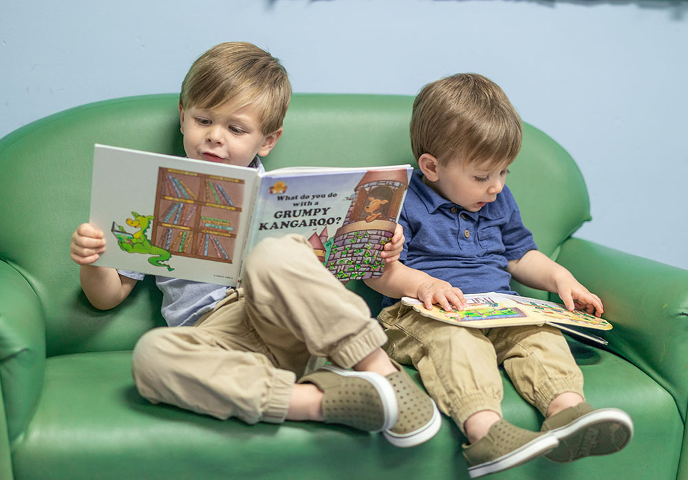 young boys reading a book at a Preschool & Daycare Serving Conway & Myrtle Beach, SC